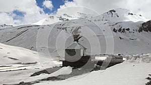 Standing alone house in front of snow mountain range in northern of India