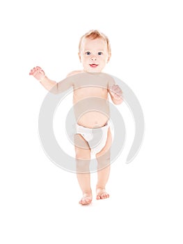 Standing baby boy in diaper