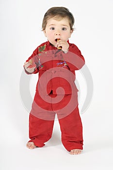 Standing baby eating rusk