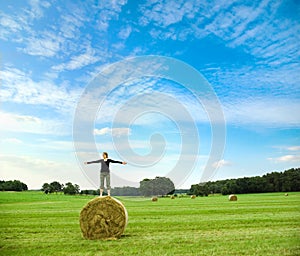 Standing on a bale of hay