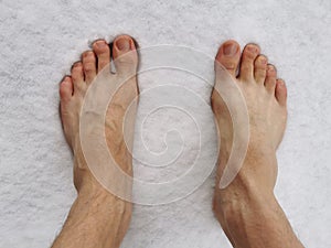 Standing barefoot in the snow, hardening of the body