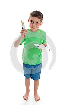 Standing boy holding paints and brushes