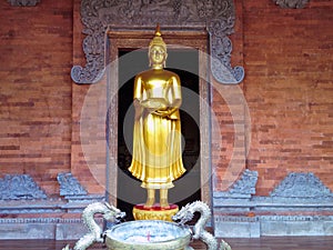 Standing Buddha Statue Carrying Jug At The Front Of Worship Room At Brahmavihara Arama Monastery