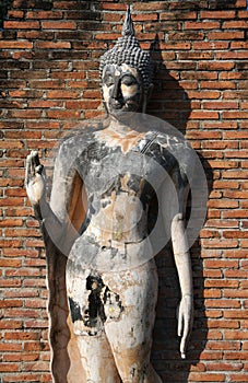 Standing Buddha statue at Sukhothai photo