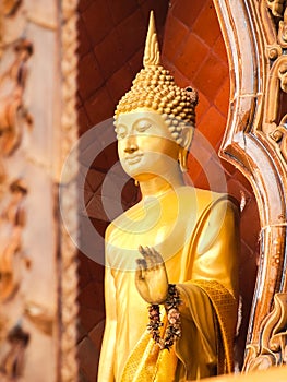 Standing Buddha status . Buddha image style pagoda.