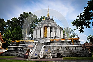 Standing Buddha on stupa and Sun shines