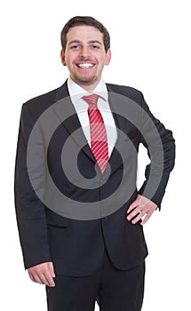 Standing businessman in black suite laughing at camera