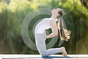Standing in Camel pose