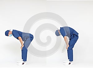 Standing caucasian medical professional  in uniform  stretching back