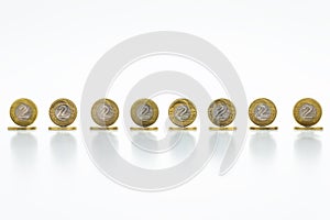 Standing coins, the Polish currency 2 PLN / Polish zloty. Isolated on white background with clipping pathwithout a shadow.