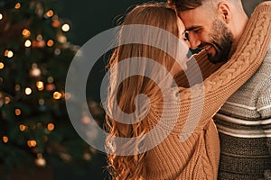 Standing and embracing. Lovely young couple are celebrating New Year at home