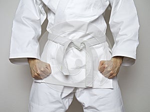 Standing fighter white belt centered martial arts white suit