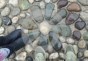 Standing on the Flower Pattern Cobblestone Path in the Light Rain