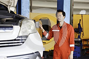 Standing In font of Garage. Car Repairman Auto Mechanic