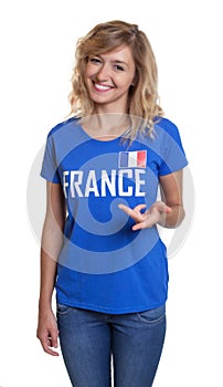 Standing french sports with blond hair and blue jersey