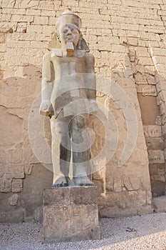 Standing in front of the statue of Ramesses II