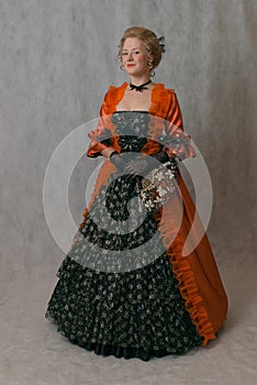 Standing girl in baroque dress