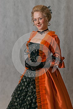 Standing girl in baroque dress
