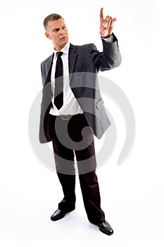 Standing lawyer looking at his index finger