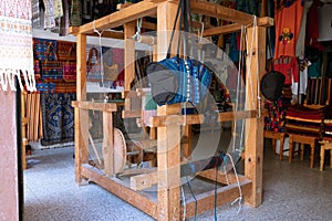 The standing loom has red, white cotton thread and is ready to be used by the Maya weaver in Guatemala.