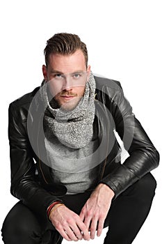 Standing man with scarf and leather jacket
