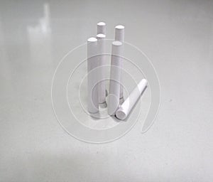 Standing of pile of white chalk isolated on white background