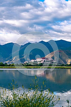 The Potala Palace, the holy place of Tibetan Buddhism by lake photo