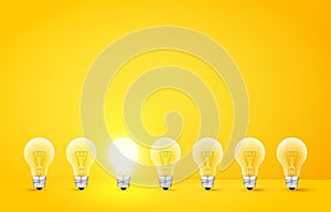 Standing in a row light bulbs with glowing one on yellow background. Unlike others or odd man out concept. Vector