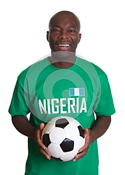 Standing soccer fan from Nigeria with ball