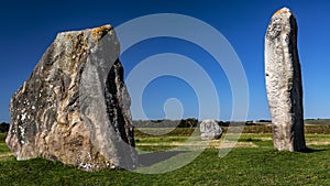 Standing stones that form part of the ancient megalith circle in the village of Avebury in Wiltshire, England, United Kingdom