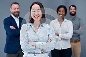 By standing together, wel remain strong and unconquerable. Portrait of a group of businesspeople standing together