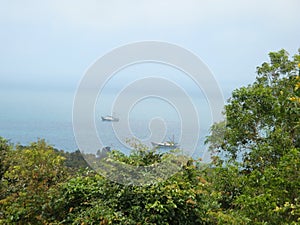Standing on the top of the mountain to see the small fishing village Clouds and sea on Wailingding Island, Zhuhai City, China