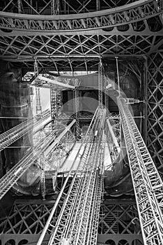 Standing under Eiffel Tower Tour Eiffel blue sky clouds black an