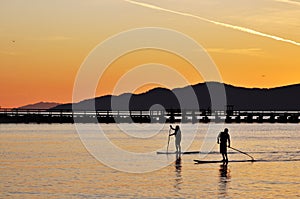 Standing up paddling photo