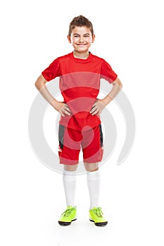 Standing young soccer player in sportswear