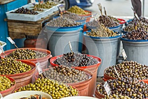 Stands with local green and black olives in Tirana, Albania.