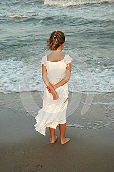 She stands on the shore photo