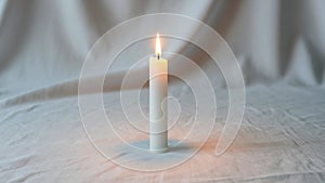 Stands upright on a plain white fabric surface creating a warm