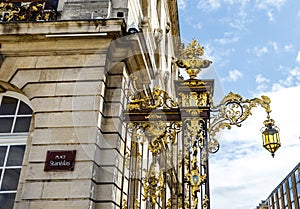 Ornate golden fence at the Place de la Carriere square in Nancy, France photo