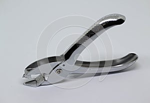 Staple remover on white background