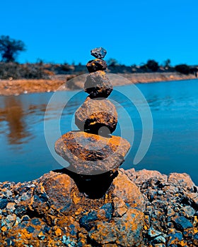 Stapled pebble stones with the riverside