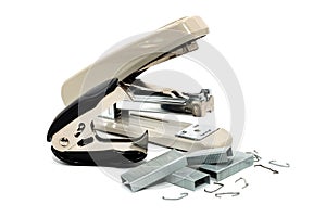 Stapler and anti-stapler with staples on a white background. Office supplies isolate