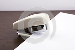 Stapler for binding sheets of paper closeup