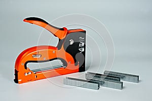 Stapler household, new, orange, reliable with staples