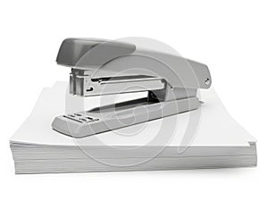 Stapler on paper stack isolated on white background