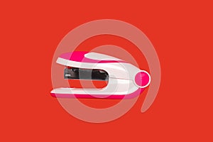 Stapler on a red background