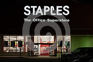 Staples office supply store entrance at night