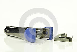 Staples and Stapler on white background