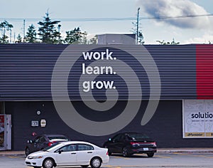 Staples Storefront motto 'Work. Learn. Grow'. Office retail store for office supplies. HALIFAX, NOVA SCOTIA, CANADA