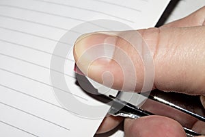 Stapler in hand.Stapling paper with staples.